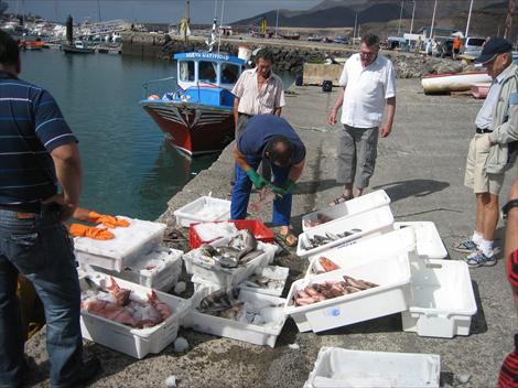 Fiskere med sin fangst